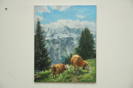 Grazing in the Highlands: Cattle Beneath Snowy Peaks